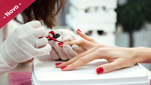 Close-up of young woman doing manicure in salon. Beauty concept.